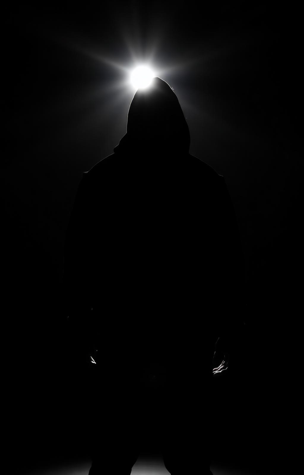 Silhouette of hooded athlete